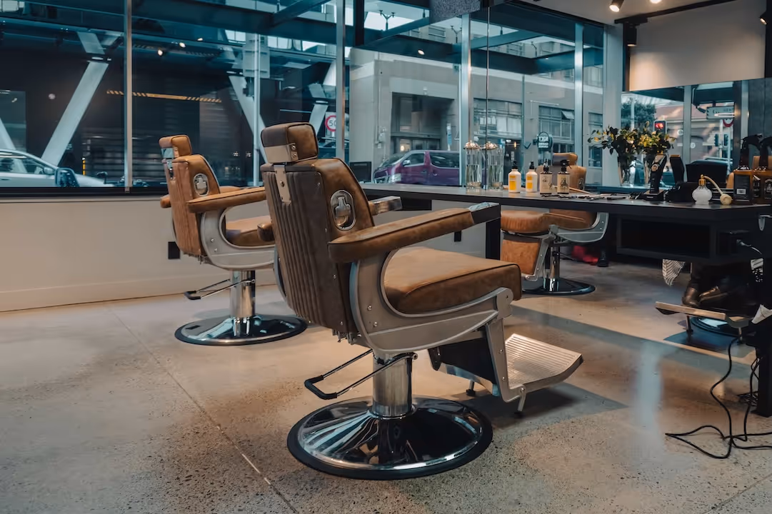 The main area of the Gentry & Blade barbershop with two professional leather chairs and mirrors.